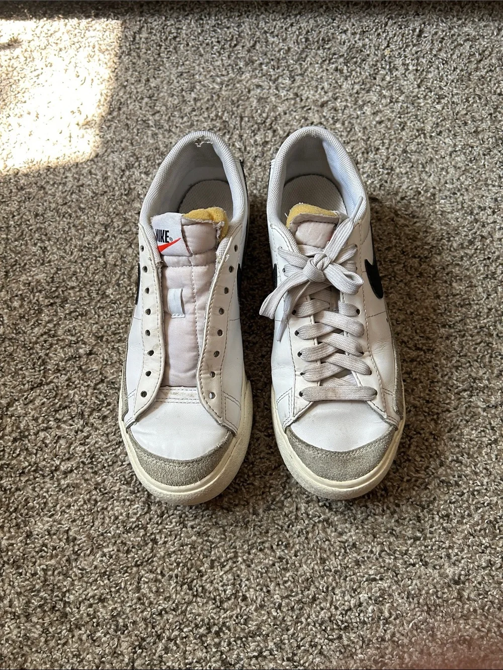 Nike White Sneakers with Black Swoosh and Yellow Tongue